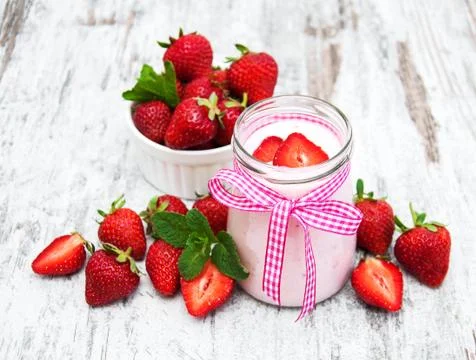 Yogurt with strawberries Stock Photos