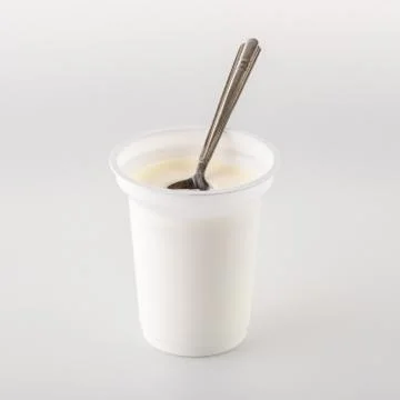 Yogurt on white. Stock Photos