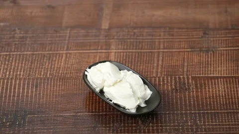 Yogurt on wood background Stock Footage 183565340