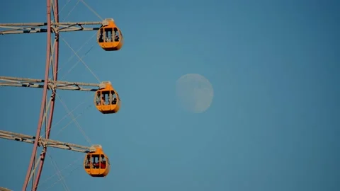 Yokohama Cosmo Clock 21 Ferris Wheel Cabins with Daytime Moon Stock Footage 325836571