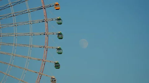 Yokohama Cosmo Clock 21 Ferris Wheel Cabins with Daytime Moon Stock Footage 325836614