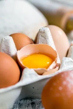 Yolk in a broken egg. Stock Photos