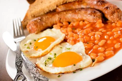 Yolk egg and beans Stock Photos