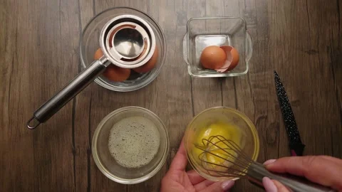 The yolk is whipped with a whisk Stock Footage 238938604