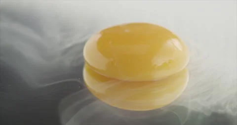 The yolk will be covered with smoke on a mirror surface Stock Footage 200868900