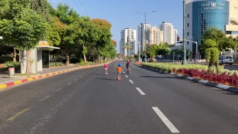 Yom Kippur Empty streets on doomsday. Children ride bicycles Stock Footage 251726074