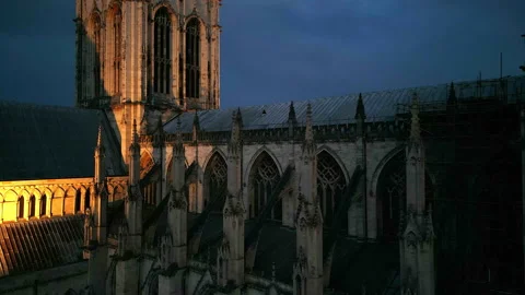 York Minster aerial, dramatic close orbit side view, at dusk with lights Stock Footage 204923750