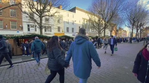 York, United Kingdom (UK) - 12/21/2023: A busy city centre street comes Stock Footage