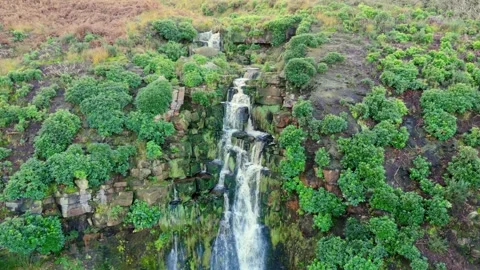 A Yorkshire moors gem, the splendid waterfall. Aerial view captures water f.. 库存影片 254163281
