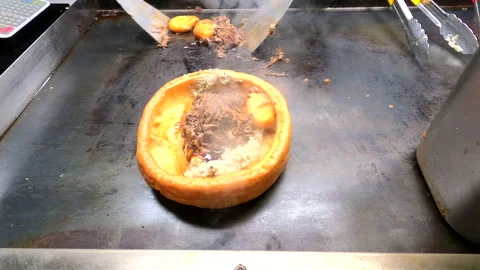 Yorkshire pudding wrap preparation on grill Stock Footage 227157823