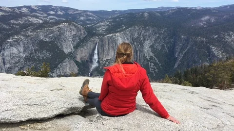 Yosemite Falls Pan to Half Dome Woman Tourist Sitting Stock-Footage 90264904