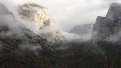 Yosemite Valley, with rolling clouds In the distance, the iconic Yosemite Falls Video stock 304593362