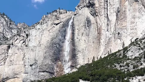 Yosemite waterfall cascading down granite cliff 動画素材 347828188
