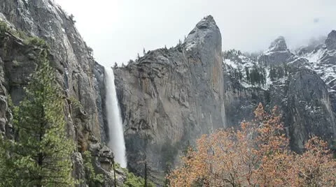 Yosemite Waterfall with snow on mountain Stock Footage 10720170