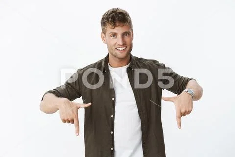 You better click downwards. Portrait of happy charming and charismatic young Stock Photos