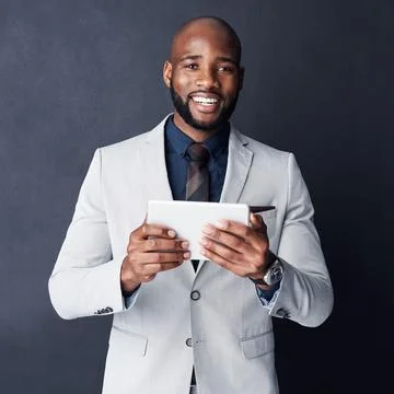 You can call it a virtual assistant. Studio shot of a businessman using a Fotos de archivo