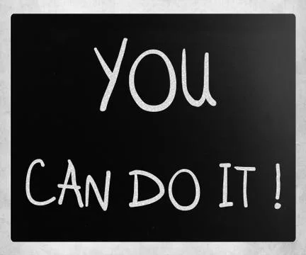 "you can do it" handwritten with white chalk on a blackboard Ilustración de archivo