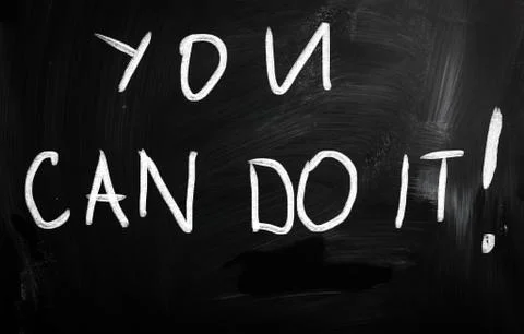 "you can do it" handwritten with white chalk on a blackboard Ilustración de archivo