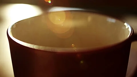 You can practically smell the fresh brewed coffee in this coffee cup Stock Footage 87857801