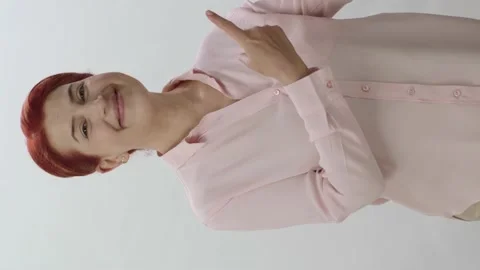 You can put whatever you want where the woman points on the white background. Stock Footage 201036165