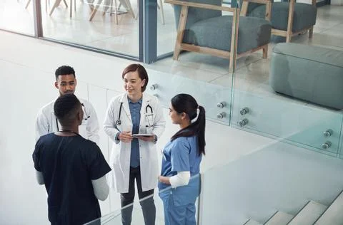 You did so well on that assignment. a group of young doctors and nurses having a Stock Photos