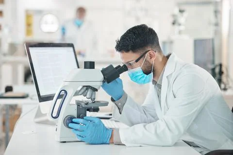 You have to look at it from different perspectives. Shot of a young scientist Stock Photos