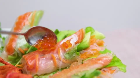 You should give me some caviar for spring rolls Red Caviar in a spoon, fish roe Vídeo Stock 307487068