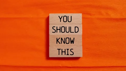 You should know this message writing on wooden blocks on orange background Stock Footage 285630931