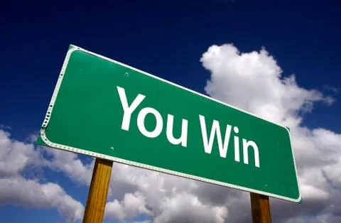 You Win Road Sign with Dramatic Clouds and Sky. Stock Photos