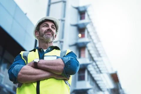 Youll always get a solid foundation with him. Shot of a engineer standing in  Stock Photos