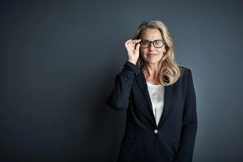 Youll often find her chasing for success. Studio portrait of a mature Stock Photos
