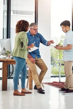 Youll want to write that down. a creative entrepreneur offering advice to two Stock Photos