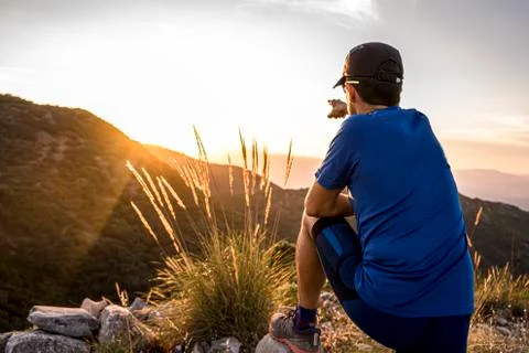 Young Active Man Pointing Direction Into The Distant Valley Stock Photos