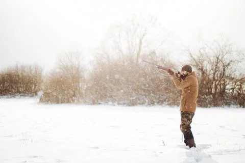 Young active man is spending time on shooting Stock Photos