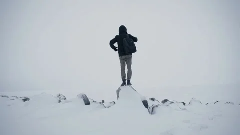 Young Active Successful Man with backpack Raising Hands On Mountain Top. Winter Stockbeeldmateriaal 102792793