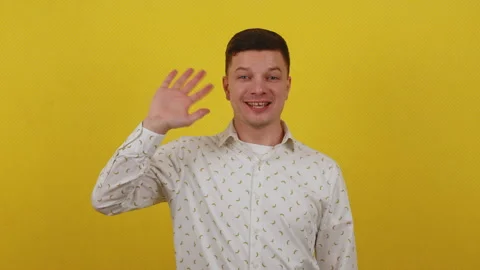 Young actor after clapperboard playing on camera standing on yellow background Stock Footage 172040790