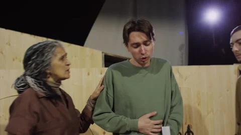 Young Actor Getting Support from Colleagues on Theatre Stage during Audition Stock Footage 279596099