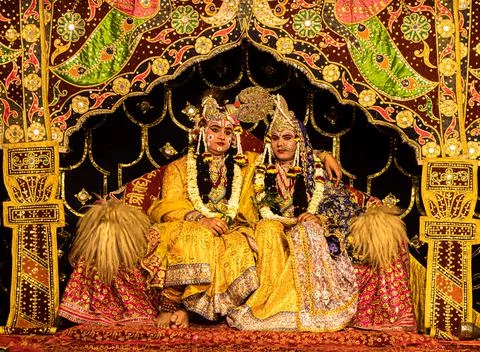 Young actor representing krishna and radha marriage on stage. Stock Photos