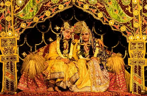 Young actor representing krishna and radha marriage on stage. Stock Photos