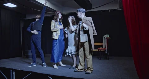 Young Actors Bowing to Applause After a Theatrical Performance on Stage Stock Footage 312064509