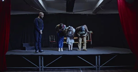 Young Actors Bowing On Stage After a Theater Play, Congratulated by Director and Stock Footage 313078897