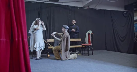 Young Actors Rehearse a Dramatic Scene on Stage, Preparing for a Captivating Stock Footage 312077738