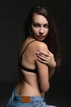 Young adorable brunette posing in studio. Stock Photos