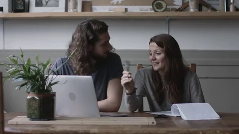 Young adult couple using a working on finance application together Stock Footage 73468043