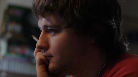 Young Adult Immersed on the Web While Smoking Stock Footage 41554297
