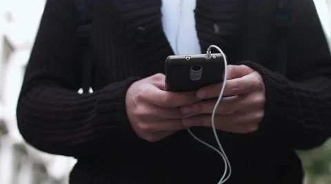 Young adult listening to music Stock Footage