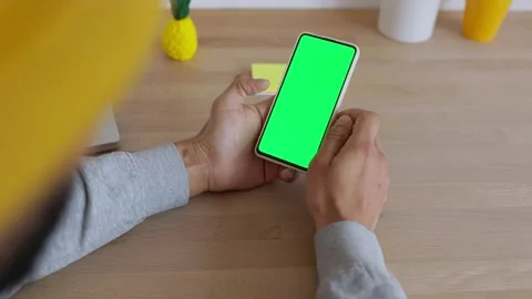 Young adult man using chroma screen mobile phone. Stock Footage 345250811