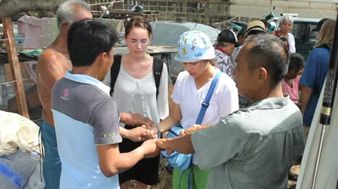 Young Adult Missionaries Praying For People Stock Footage