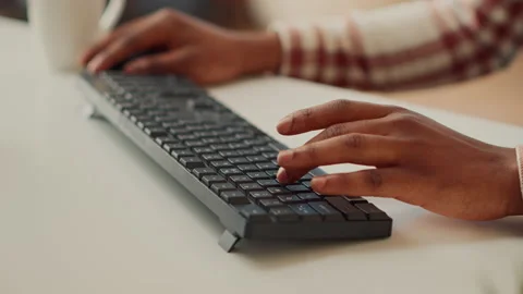 Young adult typing data to create report on computer Stock Footage 225550829