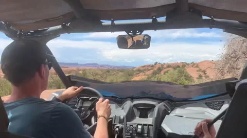 Young adults go off-roading UTV in Utah Desert POV Stock Footage 223450364